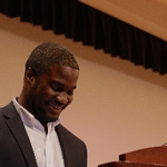 MarcQus Wright smiling at podium
